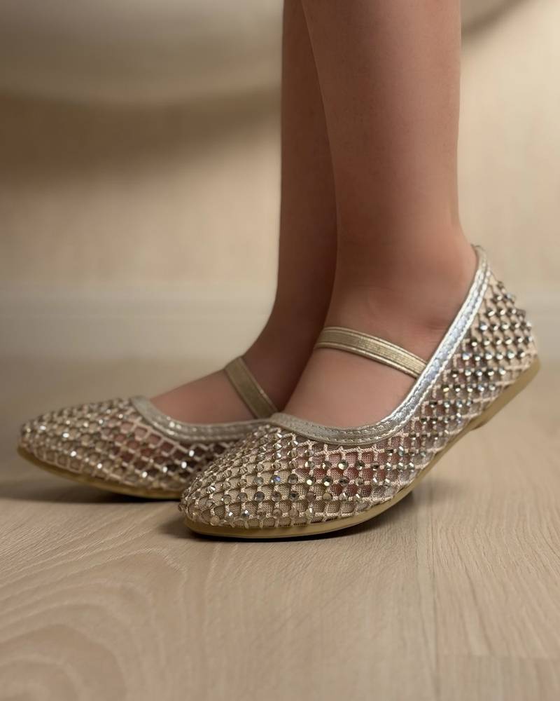 Soft girls' shoes adorned with sparkling crystals