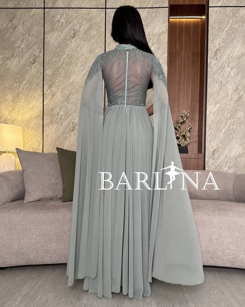 Tiffany dress with royal details and a long cape