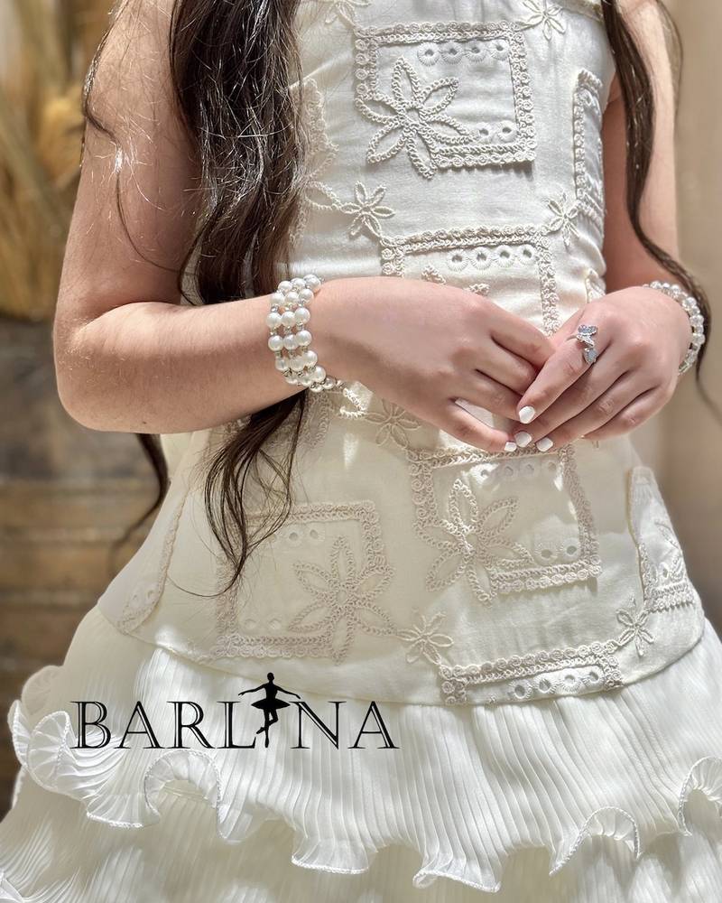 Ivory girls' dress with short ruffled layers