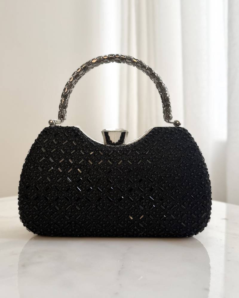 Luxury evening bag with interlocking metal handle