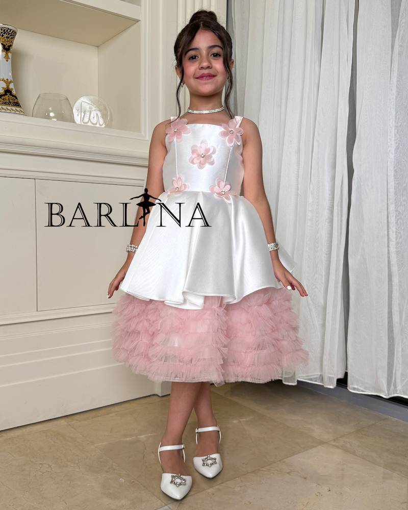 Girls' white dress with prominent flowers and ruffles