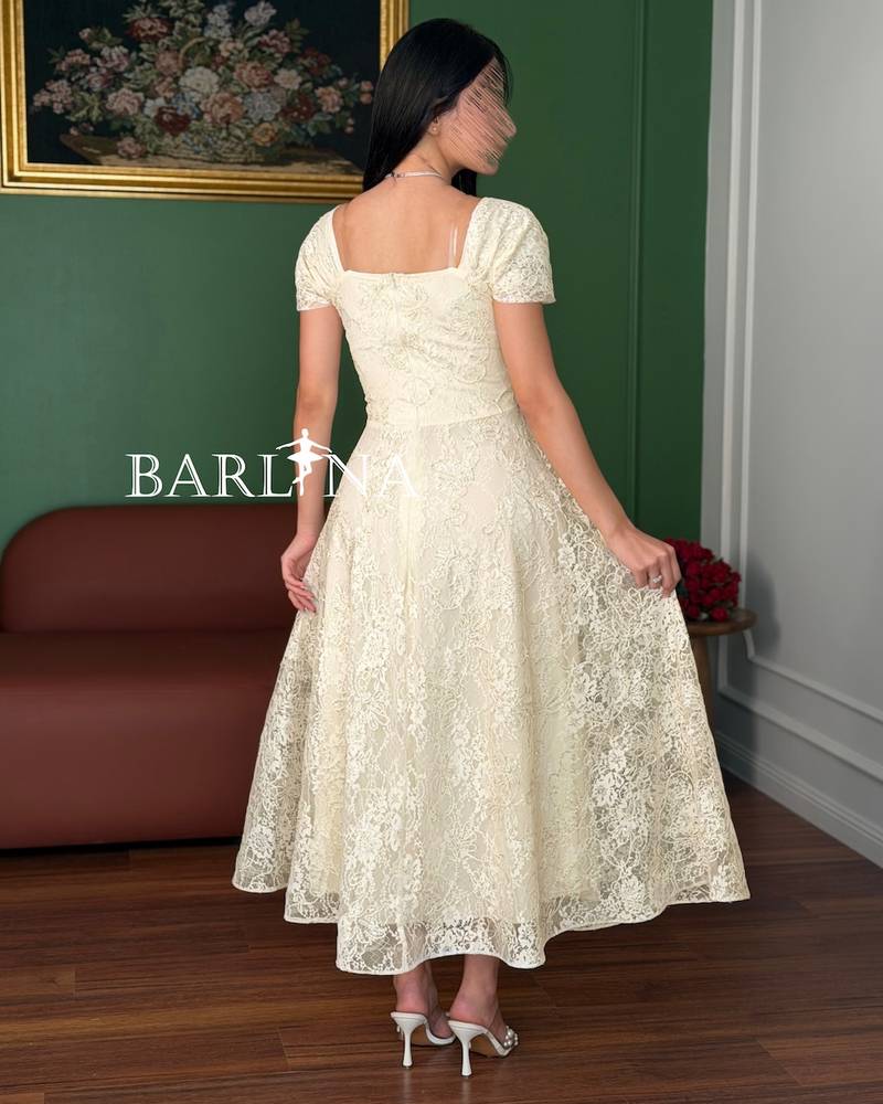 A dress made of soft off-white lace