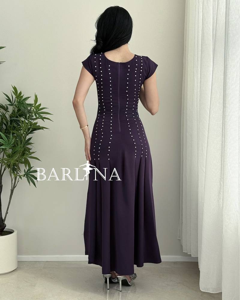 A soft purple dress with small polka dot embroidery