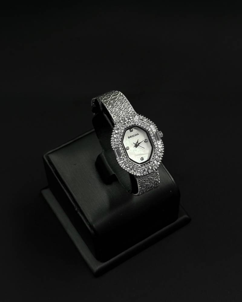 Womens watch with an oval bezel fully studded