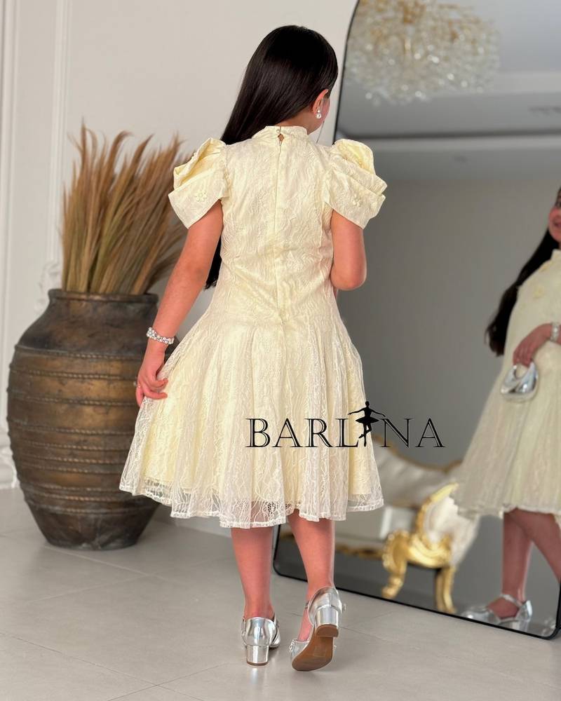 A soft girls’ lace dress with a feminine design