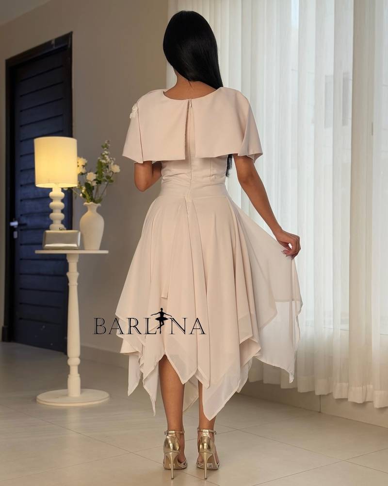 Light beige dress with an asymmetrical hem