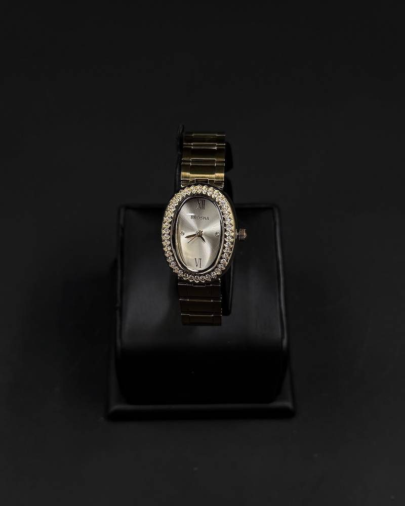 An oval-shaped watch surrounded by crystal