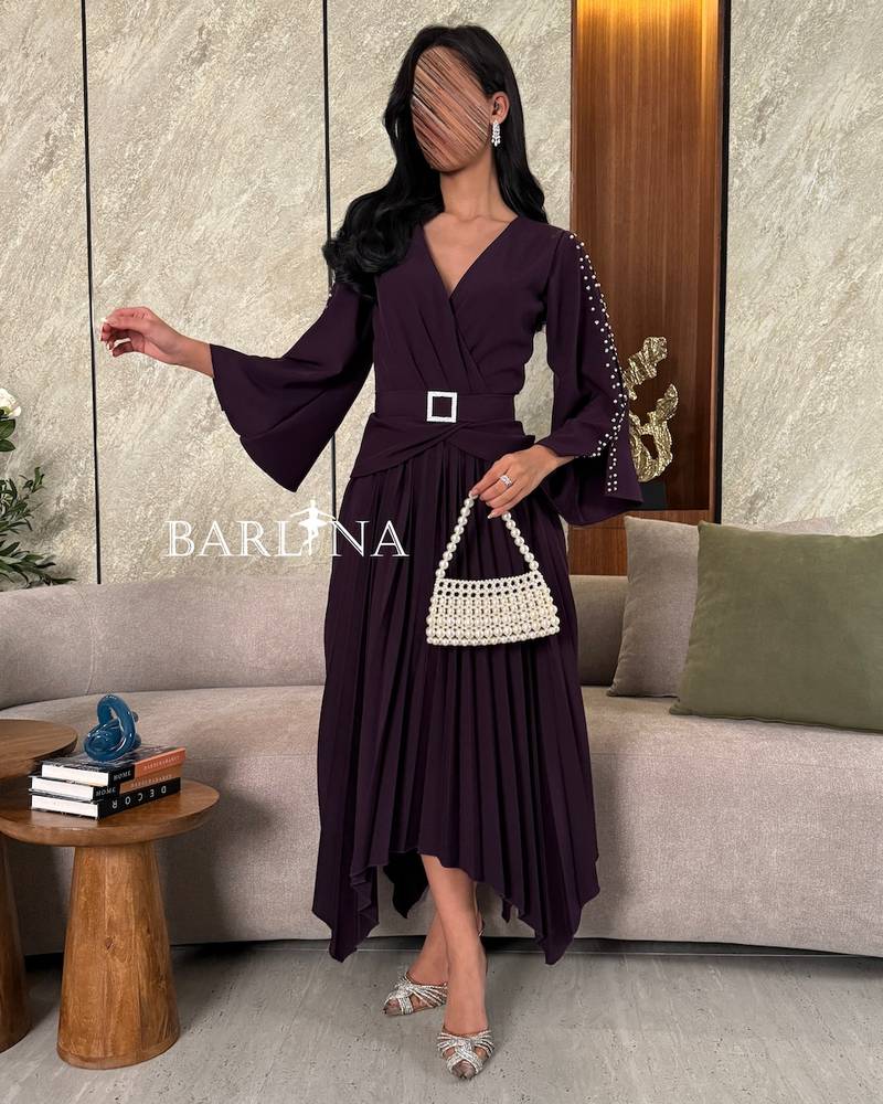 Dark purple dress with pearl embellished sleeves