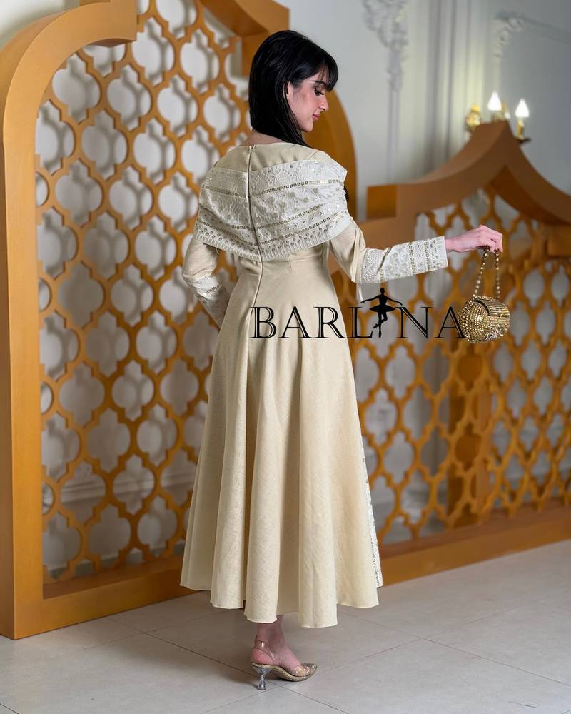 Soft off-white jalabiya with elegant traditional embroidery
