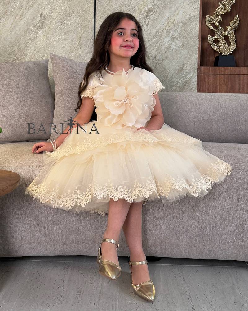 Girls beige dress with gold edges