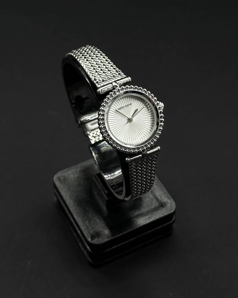 A classic round watch with a woven strap