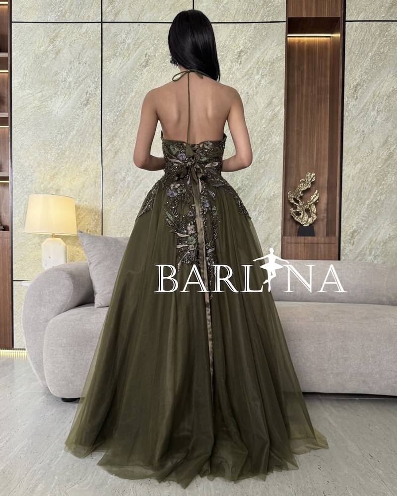 Olive green dress with shiny embroidery and front slit
