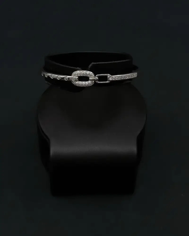 A delicate bracelet and ring with an interlocking ring design