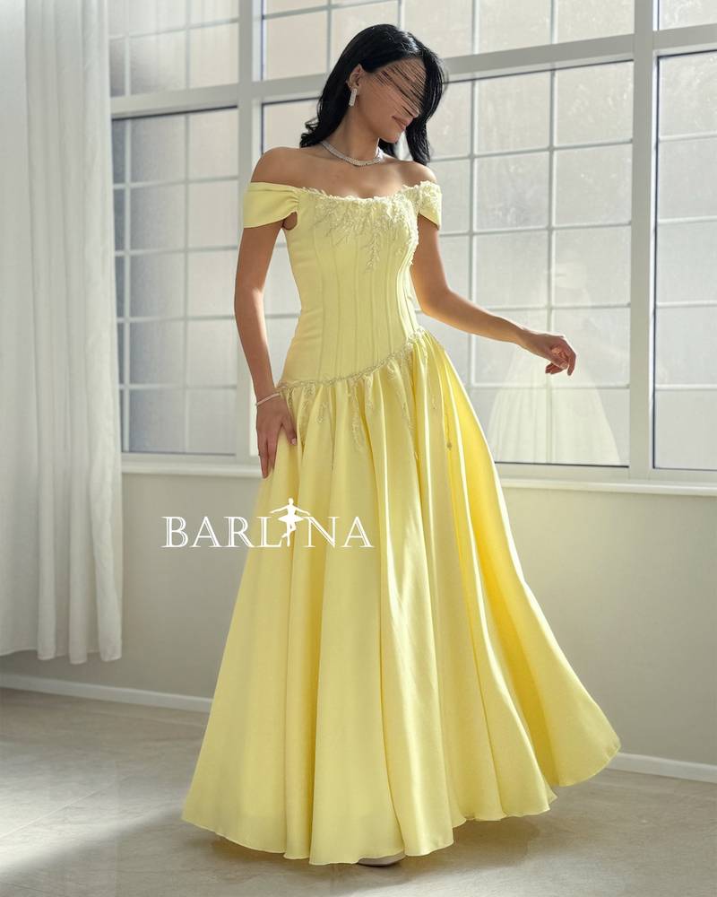 Yellow off-shoulder dress with a fitted corset
