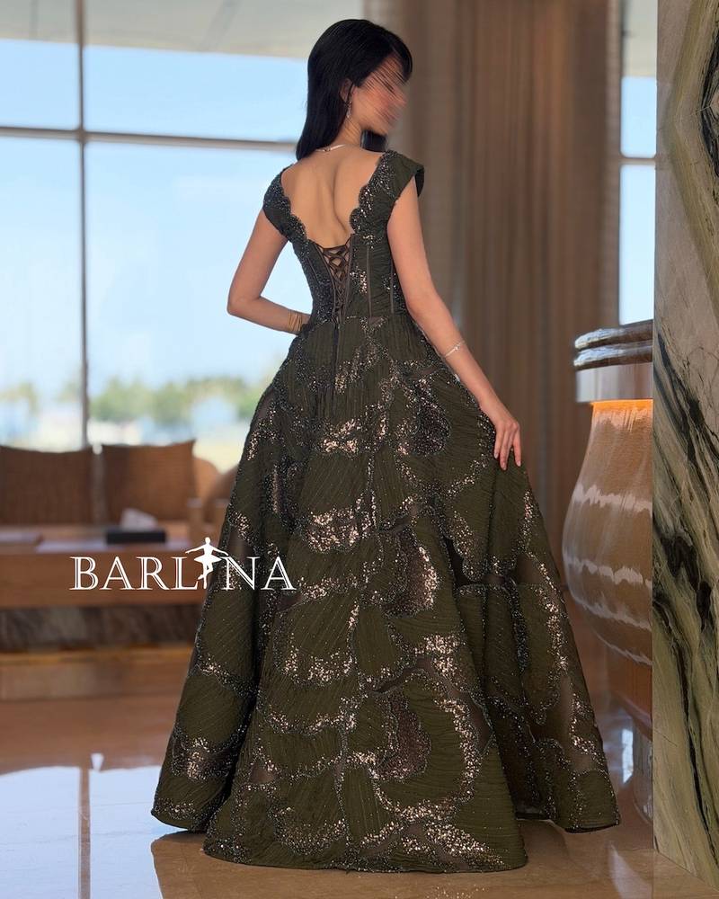 Luxurious olive evening dress with intricate embroidery