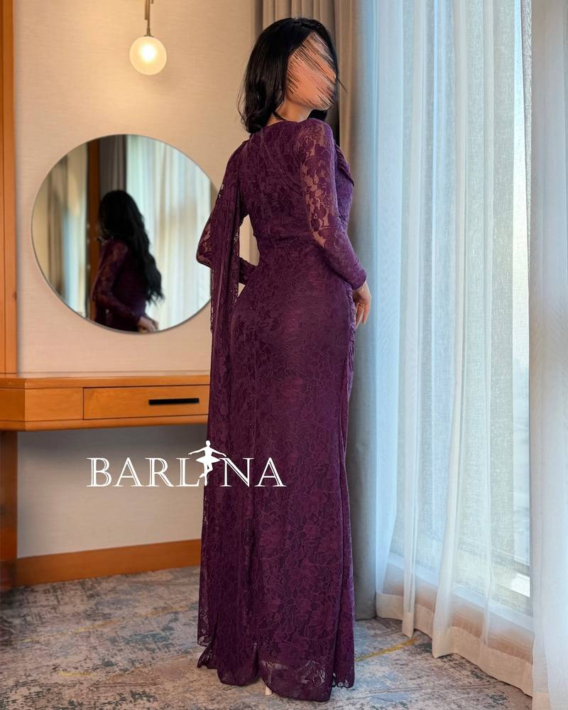 Elegant purple lace dress with a draped shawl