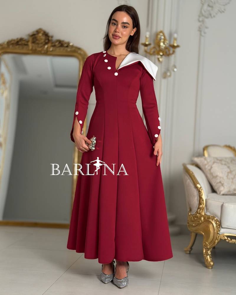 Red flared dress with an asymmetrical neckline