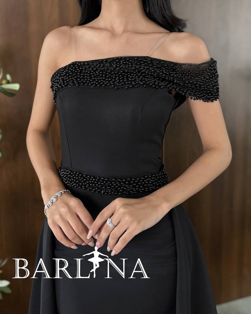 Black one-shoulder dress with pearl embroidery