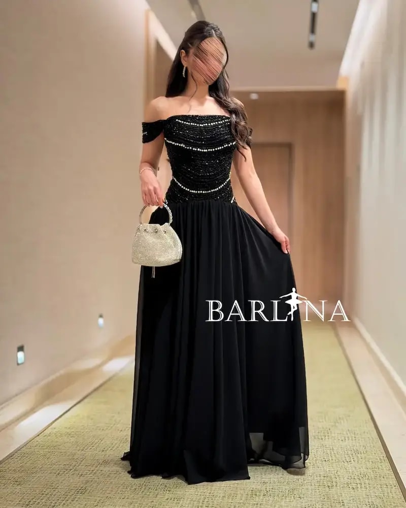 Elegant black evening dress adorned with sparkling stripes