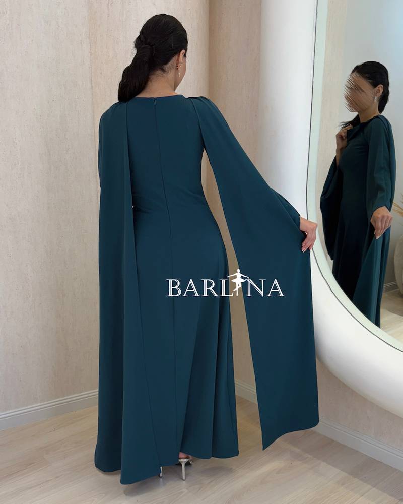 Petrol blue dress with a wide design and loose sleeves