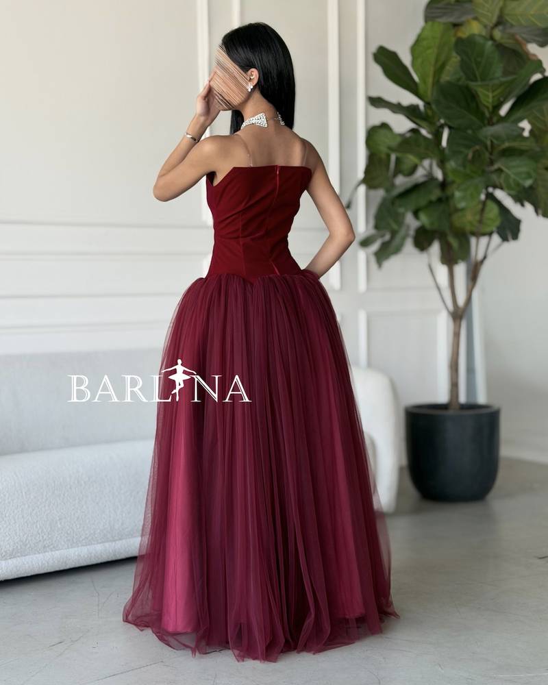 A burgundy puffy dress with a simple corset