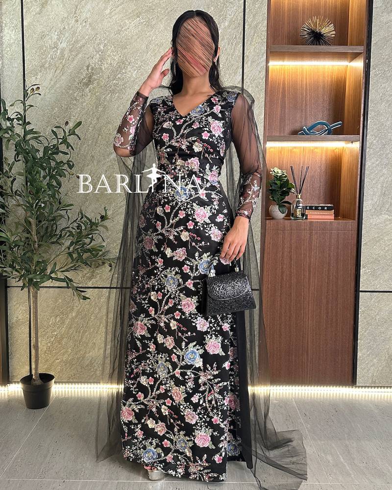Black evening dress with shiny floral embroidery