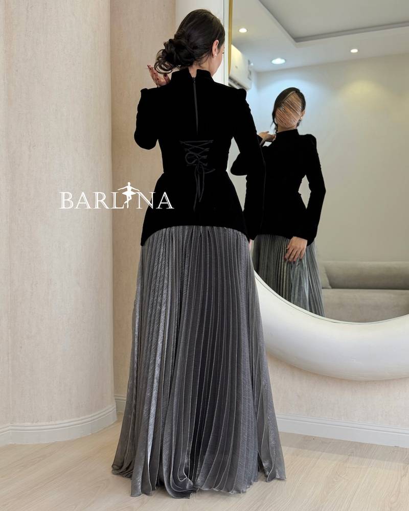Black velvet dress with long silver pleats