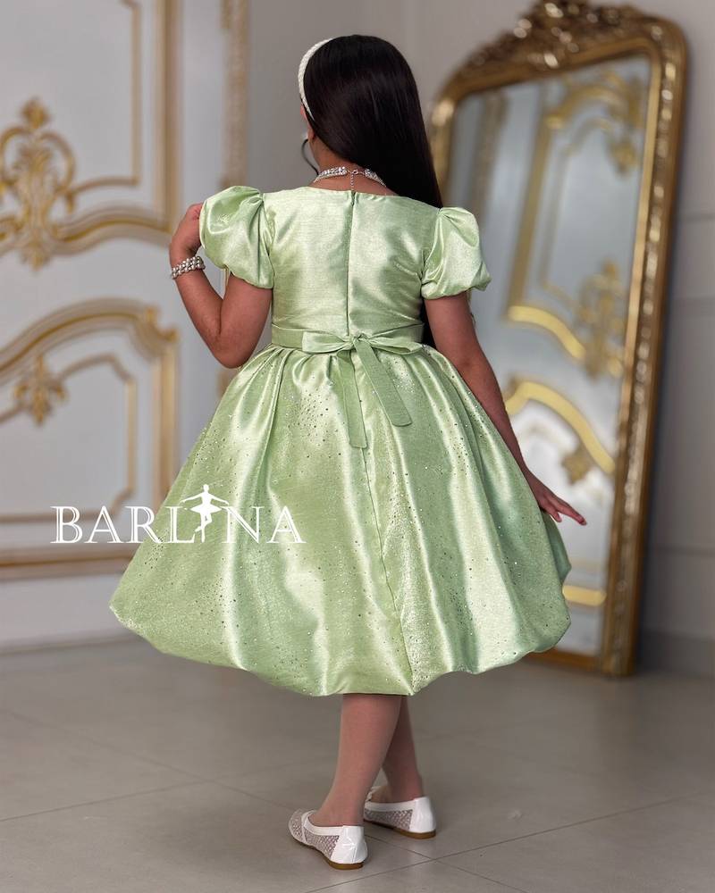 Elegant girl's dress with a bow on the chest