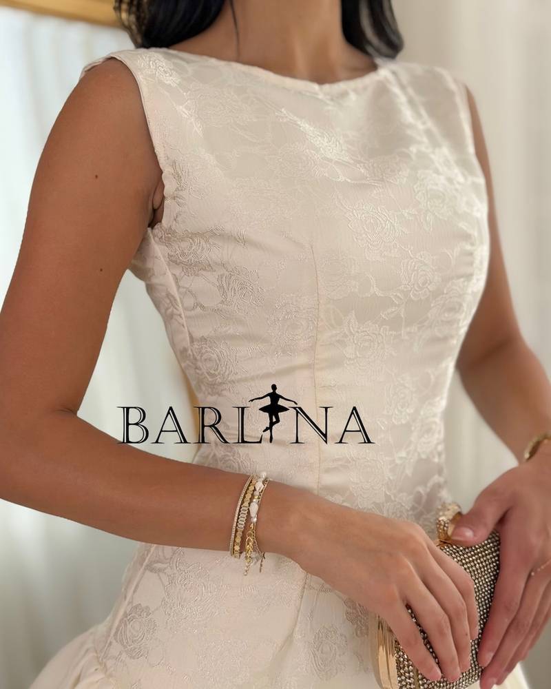A soft dress with a low waist and layers of ruffles