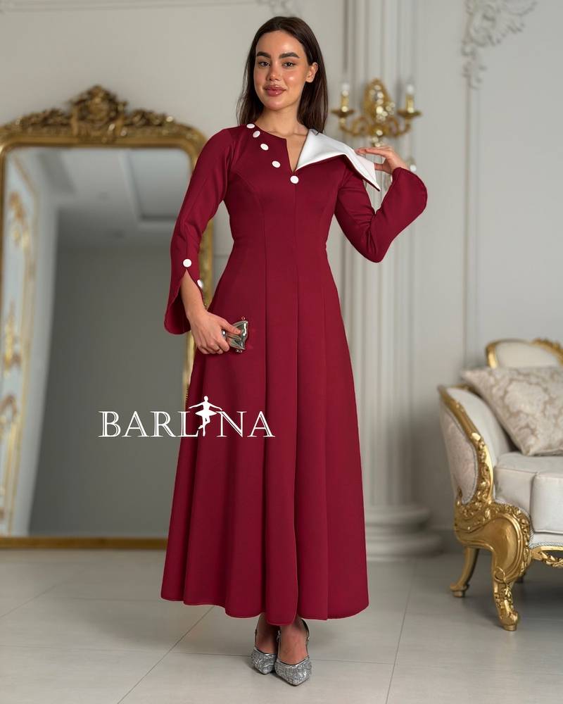 Red flared dress with an asymmetrical neckline
