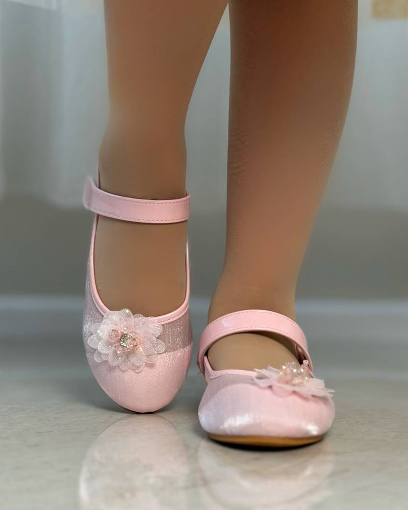 Girls' shoes with delicate details and a subtle sheen
