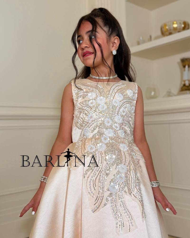 Girls' dress with a long train and an open back
