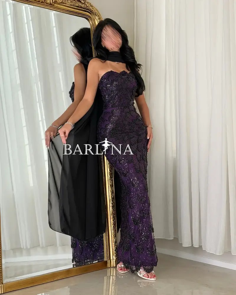 A purple embroidered dress with an elegant shawl