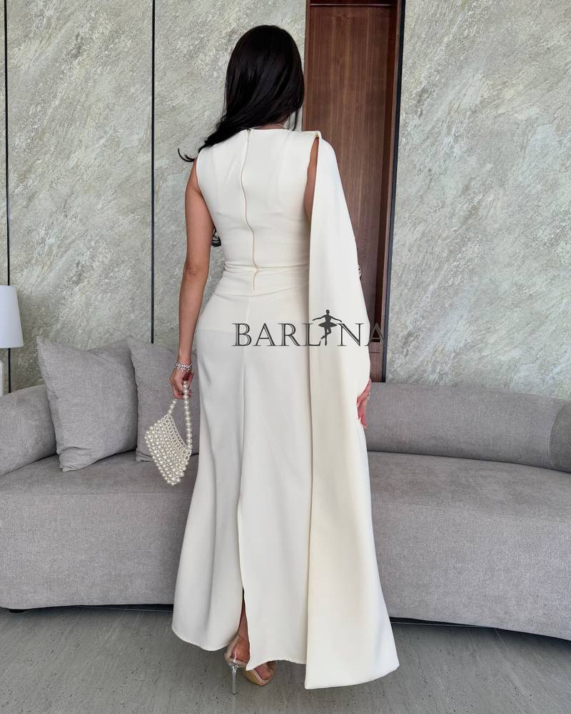 White one shoulder dress with draped fabric