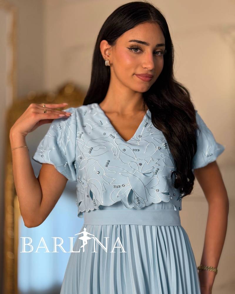 Sky blue pleated dress with short puffed sleeves