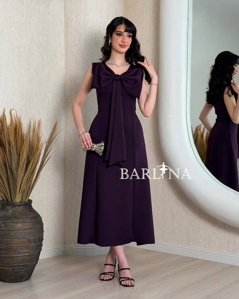 Dark purple midi dress with a large bow
