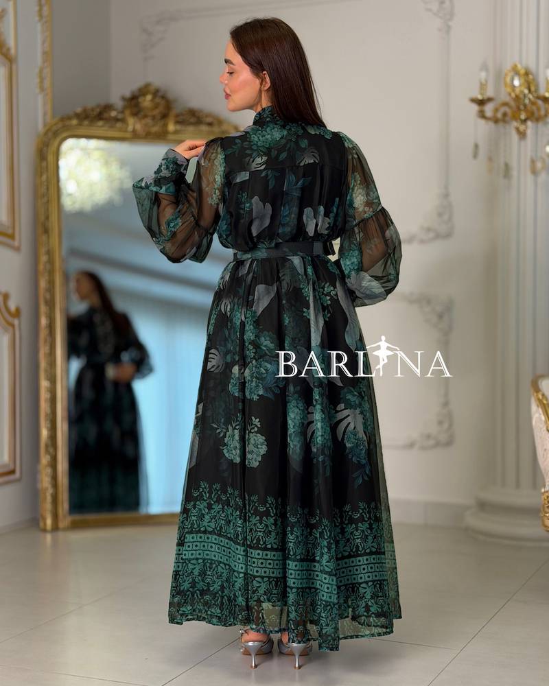 Long black dress with a green pattern