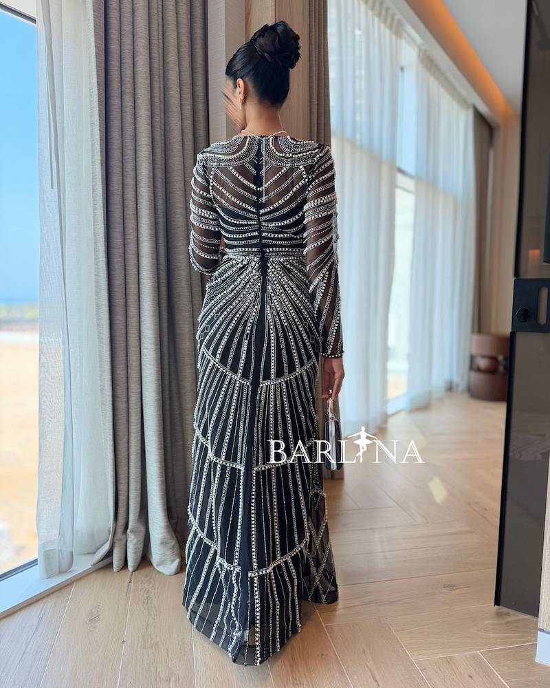 Black dress embroidered with shimmering lines