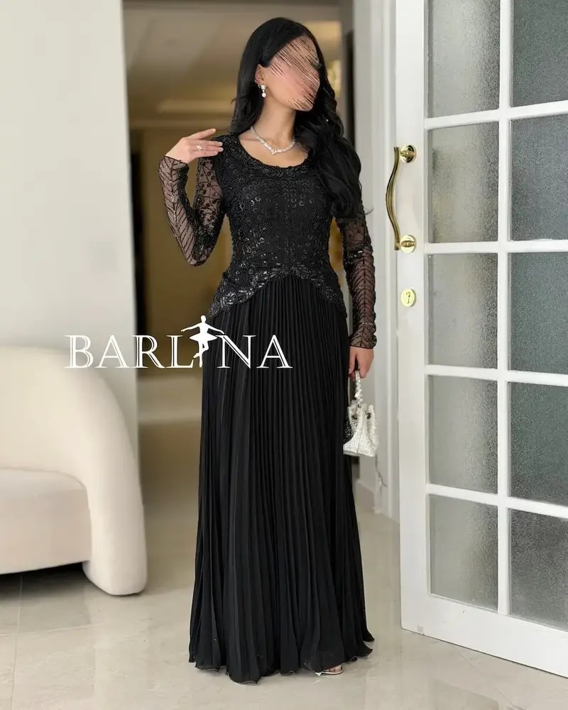 Luxurious black dress with embroidery on the top