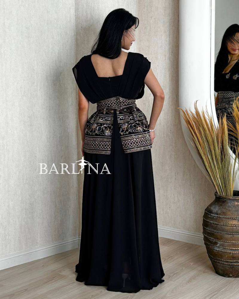 Long black jalabiya with elegant, harmonious embroidery