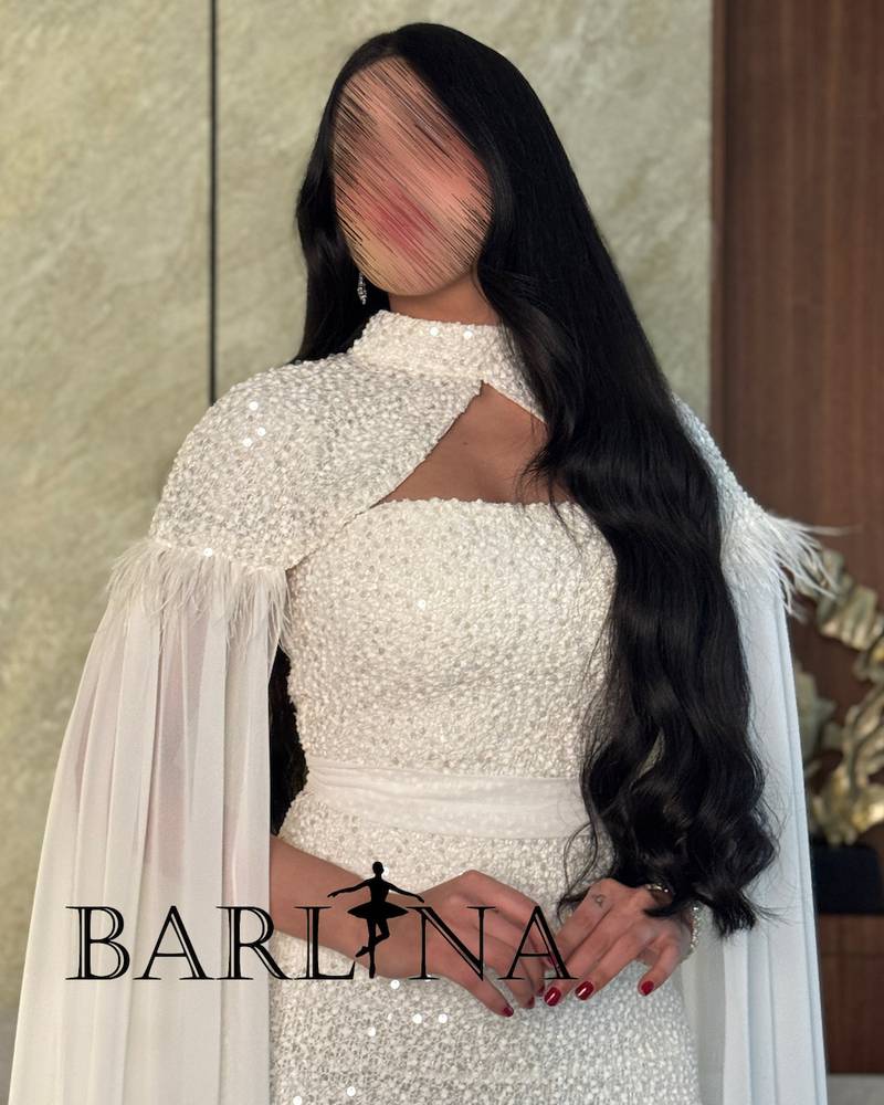 White dress with pearl embroidery and a transparent cape