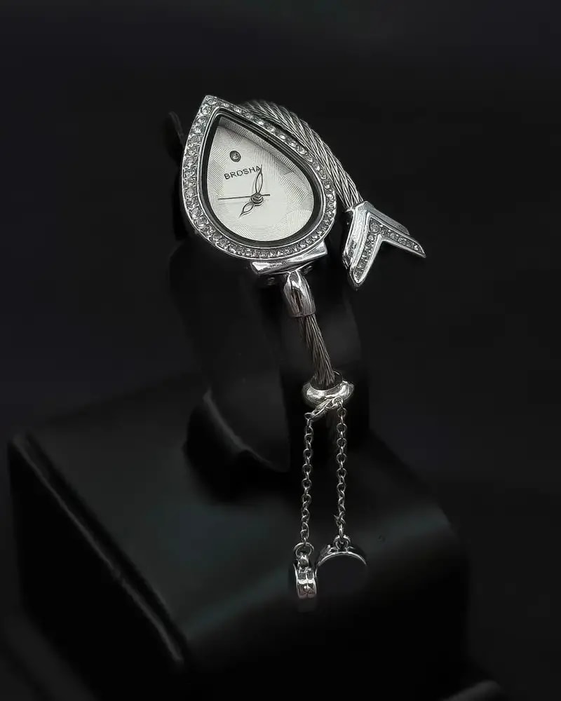 Teardrop-shaped wristwatch adorned with sparkling crystals