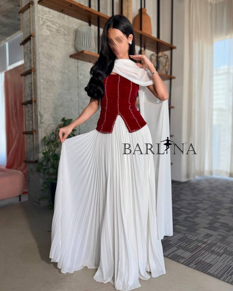 White pleated dress with a velvet bodice