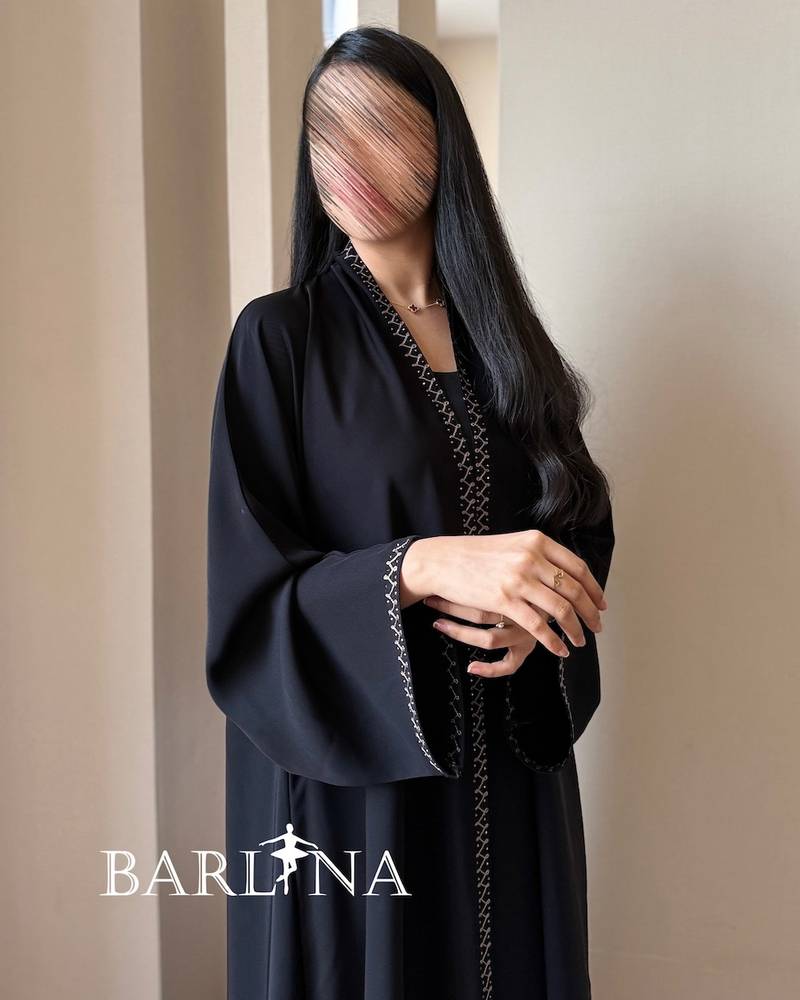 Black abaya with geometric embroidery on the edges
