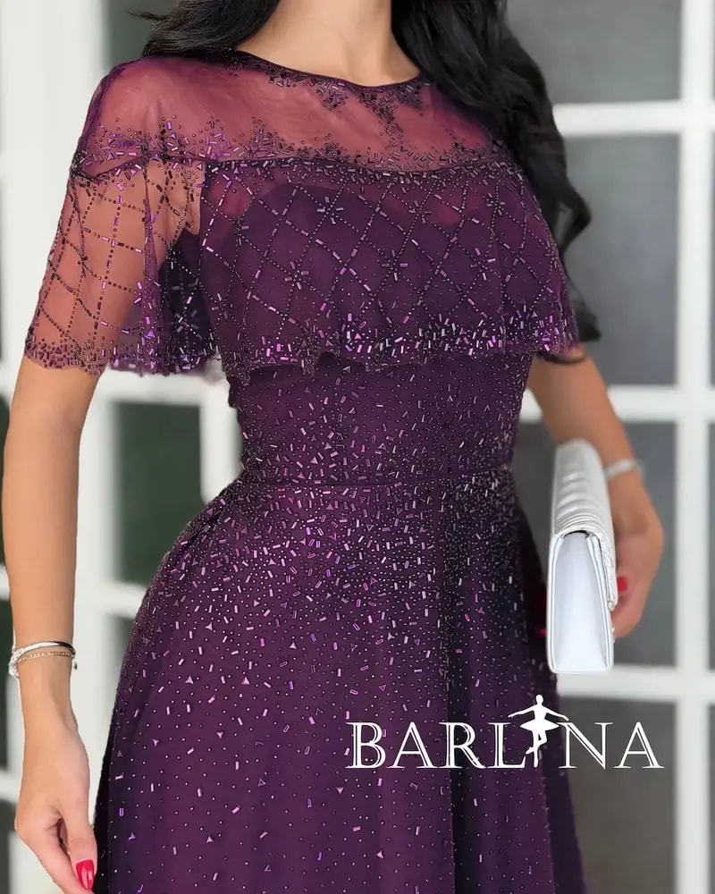 Purple tulle evening dress decorated with sequins