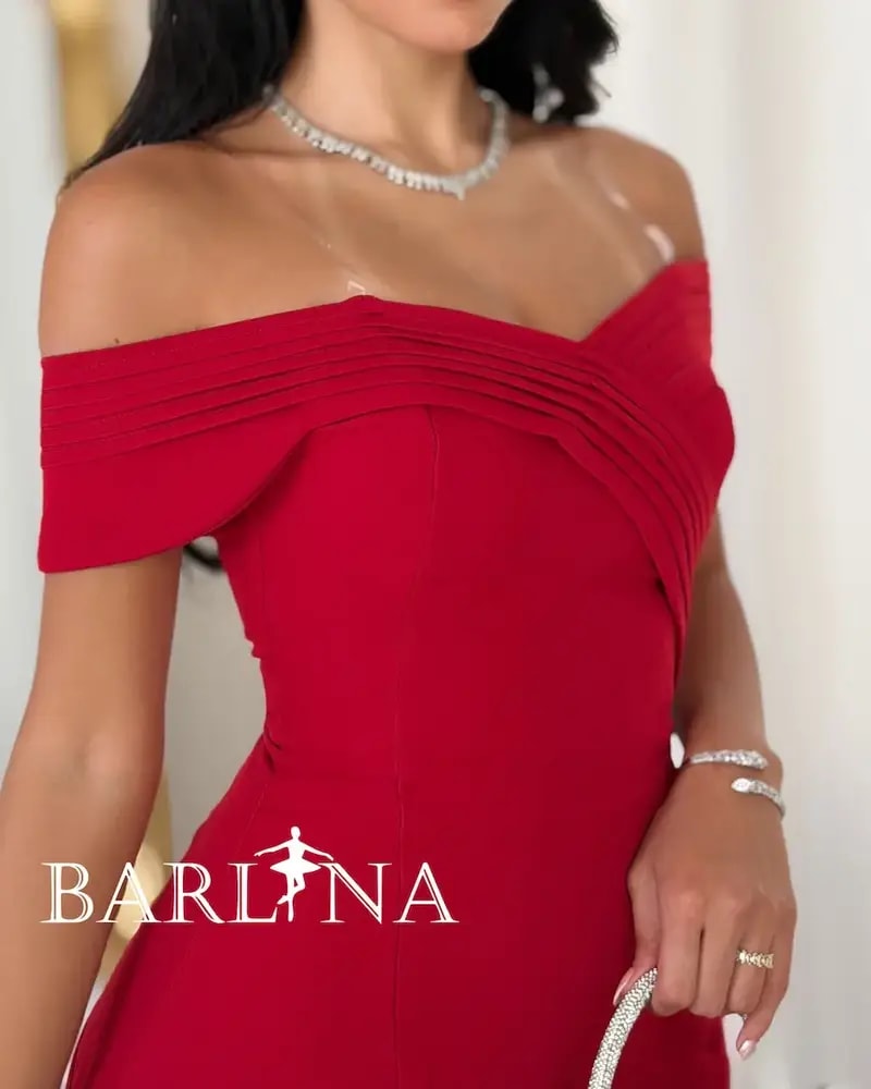 Long red dress with a flowing off-the-shoulder design