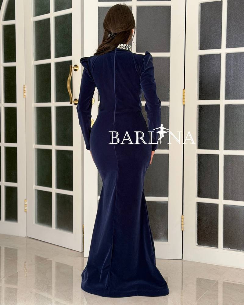 Navy velvet dress with a studded neckline