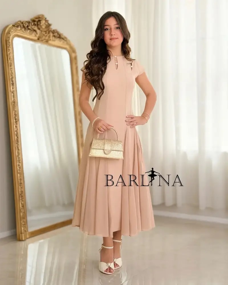 Elegant nude dress adorned with pearl details