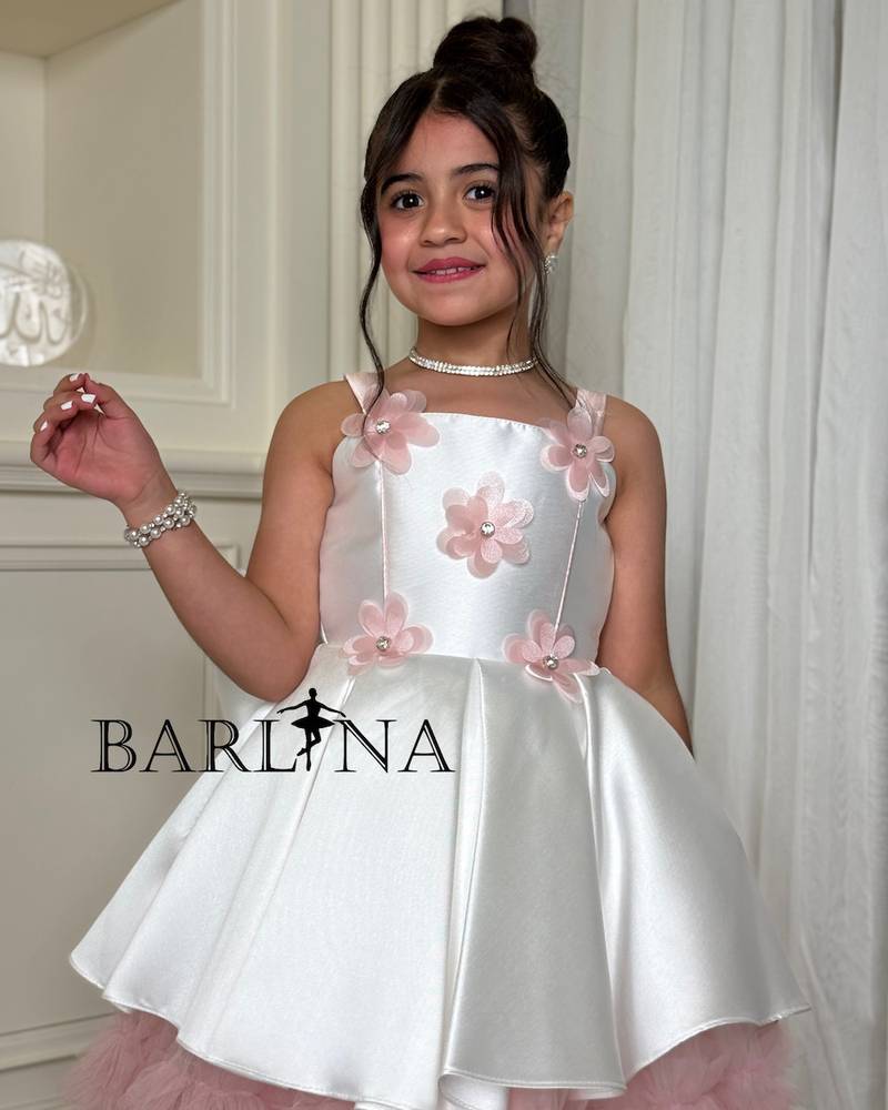 Girls' white dress with prominent flowers and ruffles