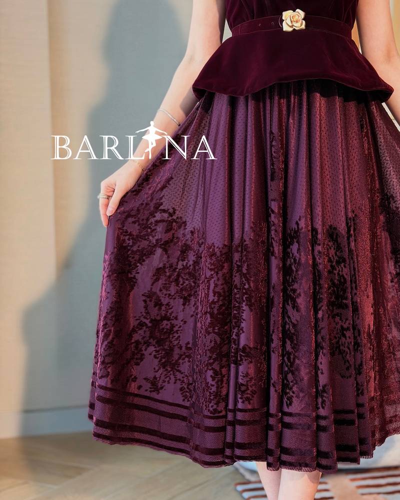 Burgundy peplum dress with a gold flower belt